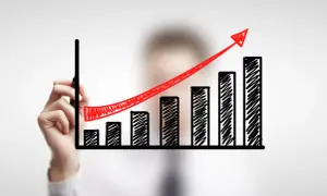 Grafico a barre con freccia rossa in crescita, simbolo di successo per le aziende innovative.