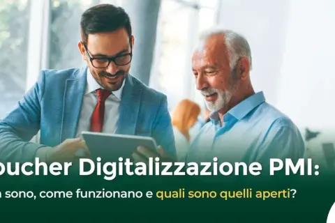 Due uomini discutono di voucher per la digitalizzazione PMI, esplorando opportunità e benefici per le piccole e medie imprese.