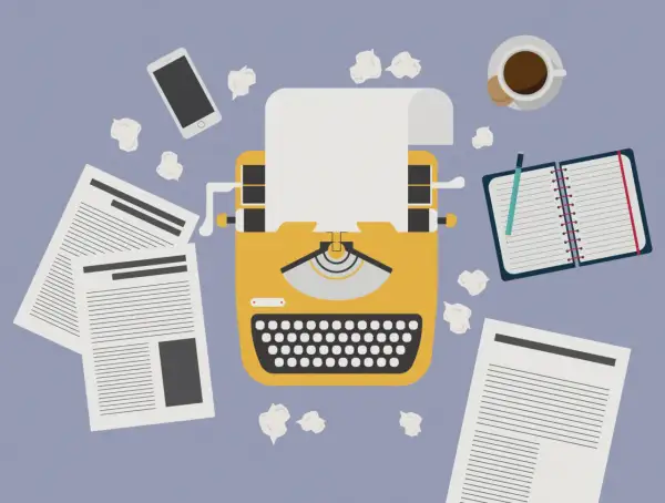 Macchina da scrivere gialla, fogli, smartphone, taccuino e caffè. Un invito a essere creativi, anche quando le idee sembrano finite.